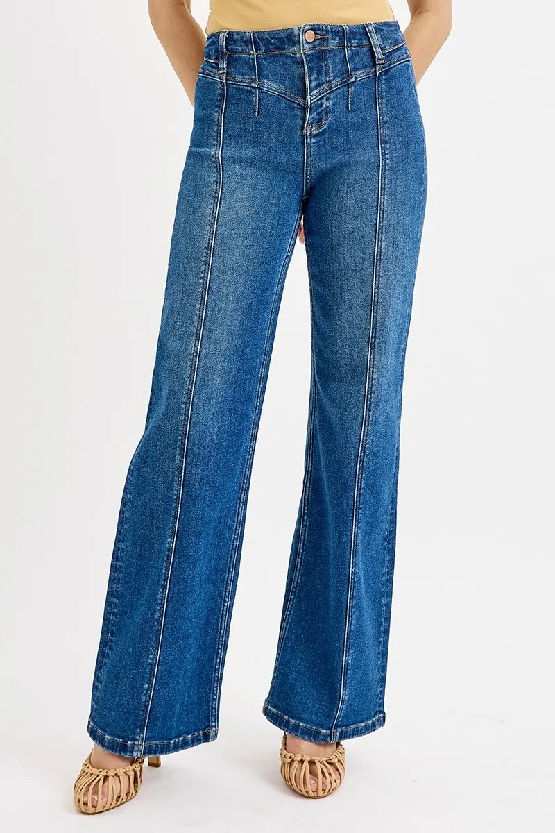 Blue jeans worn by a person on a white background
