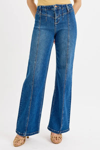 Blue jeans worn by a person on a white background