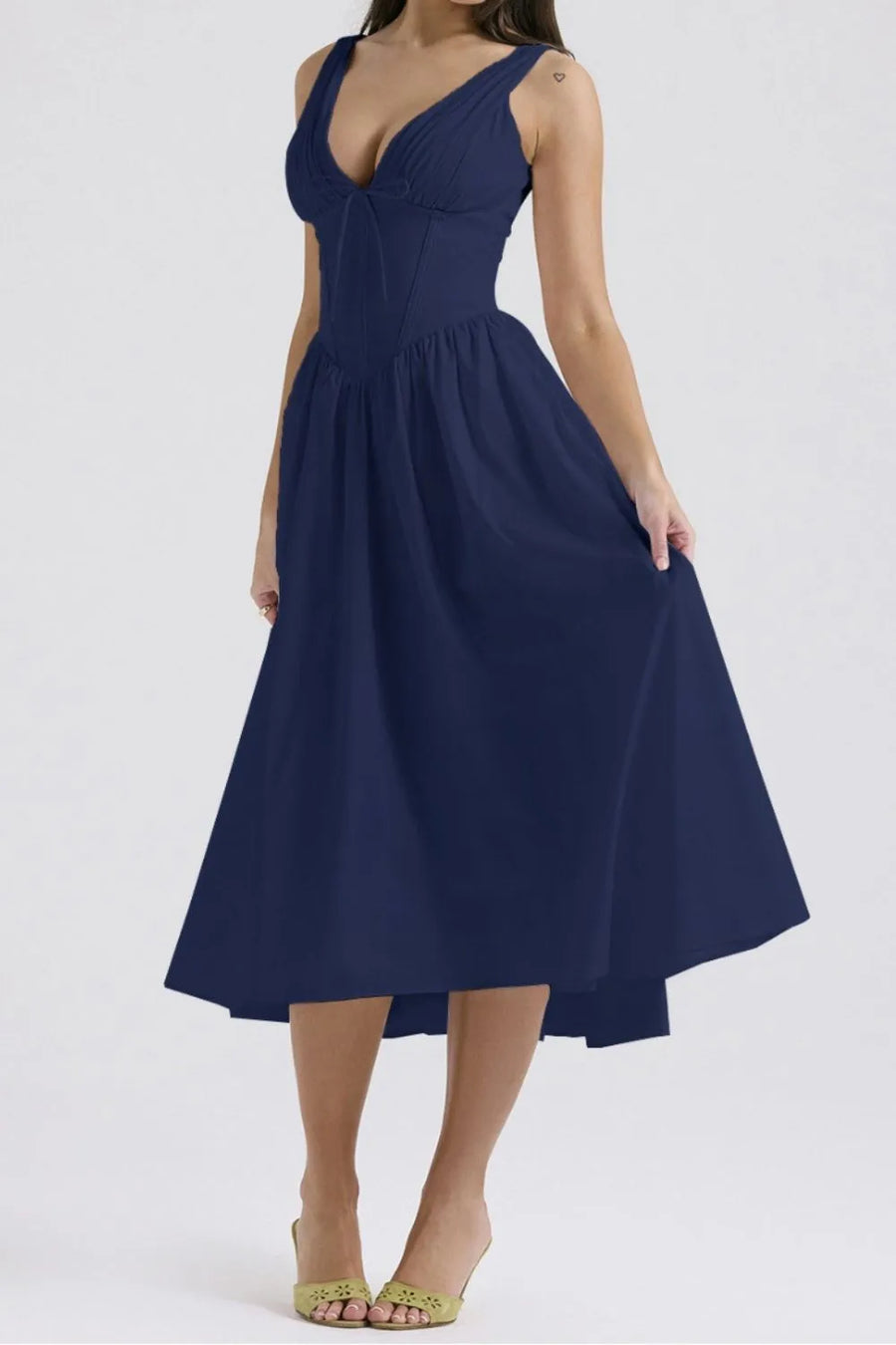 Navy blue dress worn by a person on a white background