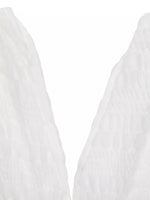 Close-up of a white fabric texture on a white background