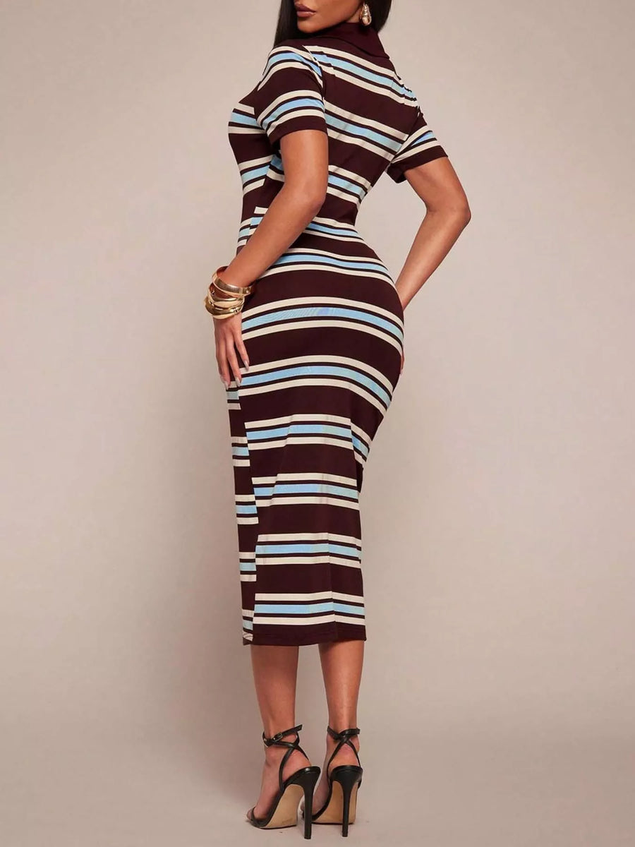 Woman wearing a striped dress with a plain background
