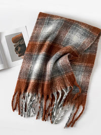 Plaid scarf with brown, gray, and white colors on a white background