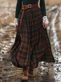 Person wearing a plaid skirt with a belt in a natural setting