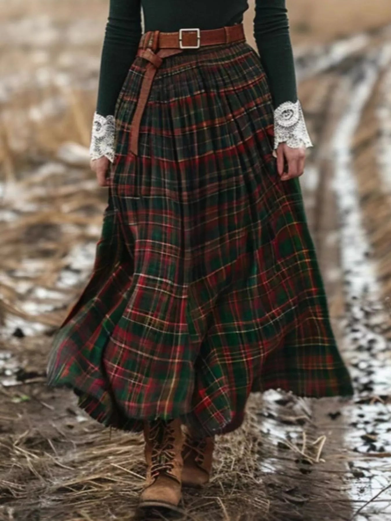 Person wearing a plaid skirt with a belt in a natural setting