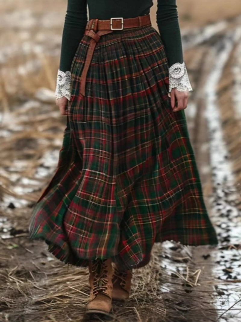 Person wearing a plaid skirt with a belt in a natural setting