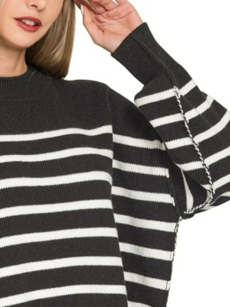 Black and white striped sweater with a close-up of the sleeve.