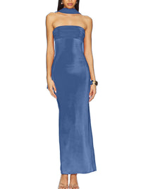 Woman wearing a blue strapless gown on a white background
