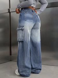 Person wearing blue gradient wide-leg jeans with cargo pockets against a metallic background