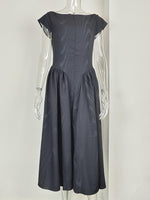 Dark gray dress on a mannequin against a white background