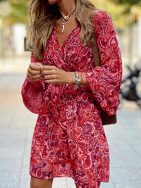 Woman wearing a red patterned dress outdoors