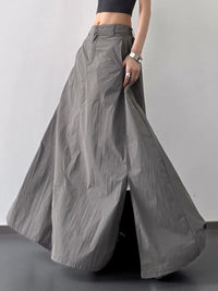 Gray wide-leg pants being modeled on a plain background