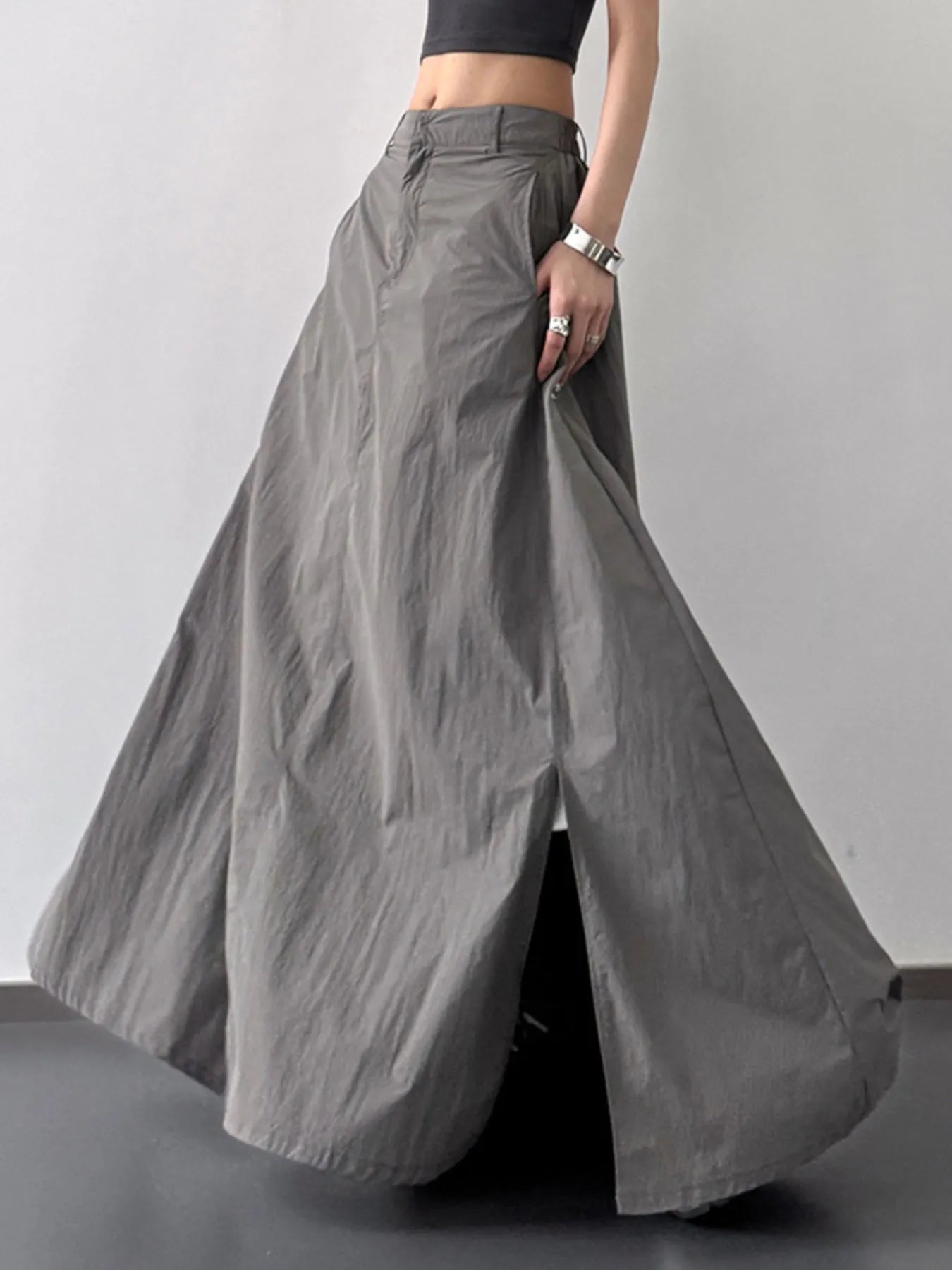 Gray wide-leg pants being modeled on a plain background