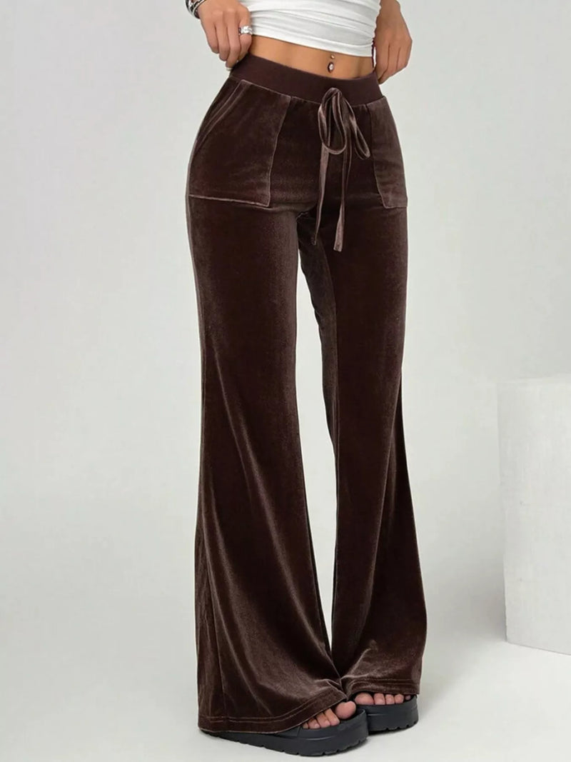 Brown velvet pants with a drawstring waist on a white background
