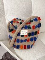 Colorful textured bag with a visible brand label on a light background