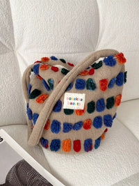 Colorful textured bag with a visible brand label on a light background