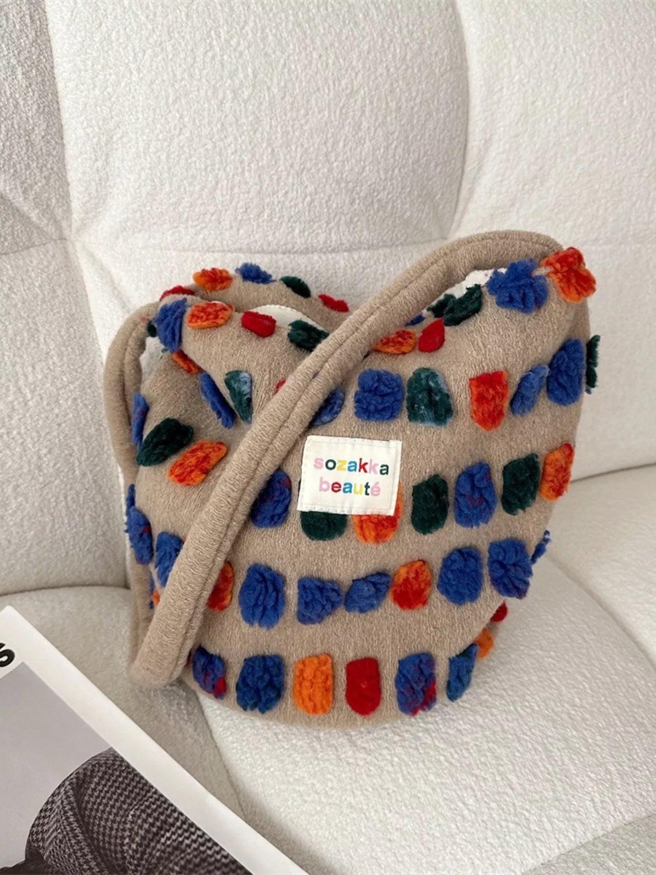 Colorful textured bag with a visible brand label on a light background