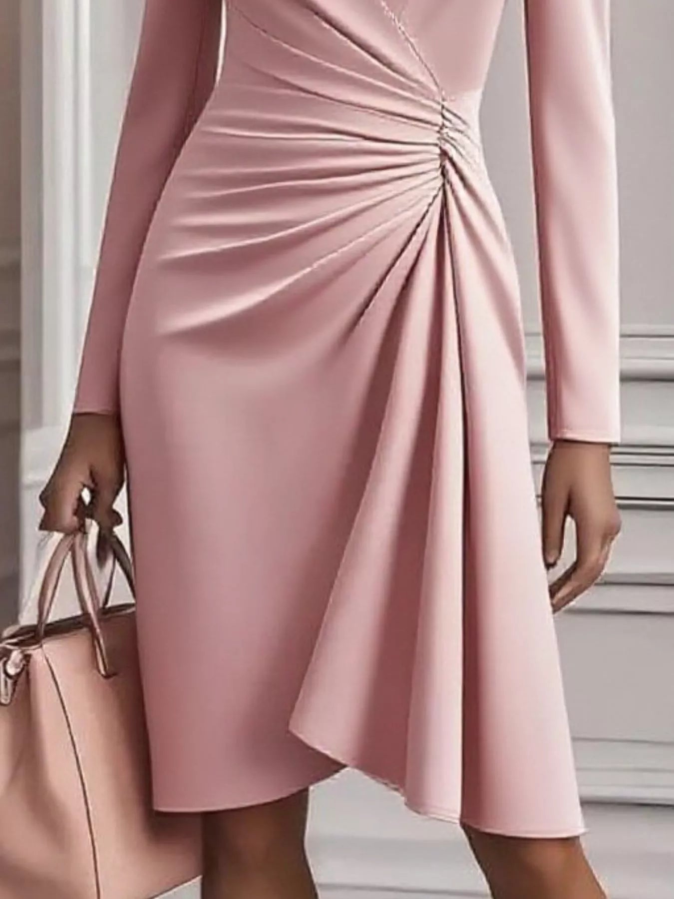 Pink dress with a ruched detail on a neutral background