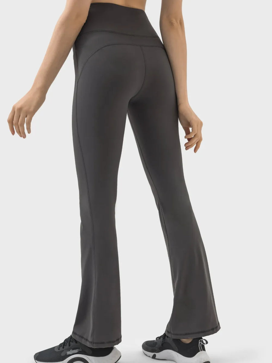 Dark gray leggings worn by a person on a white background