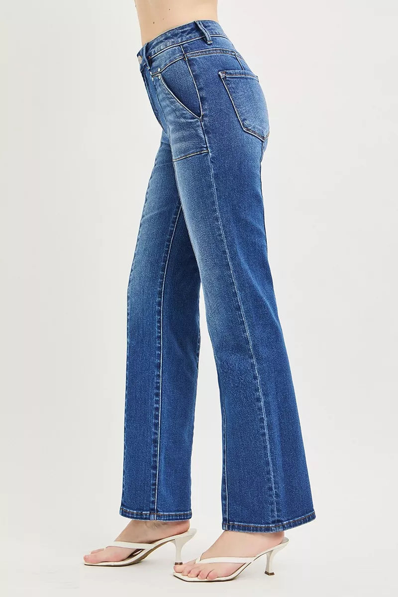 Blue jeans worn by a person on a white background