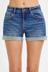 Blue denim shorts on a white background