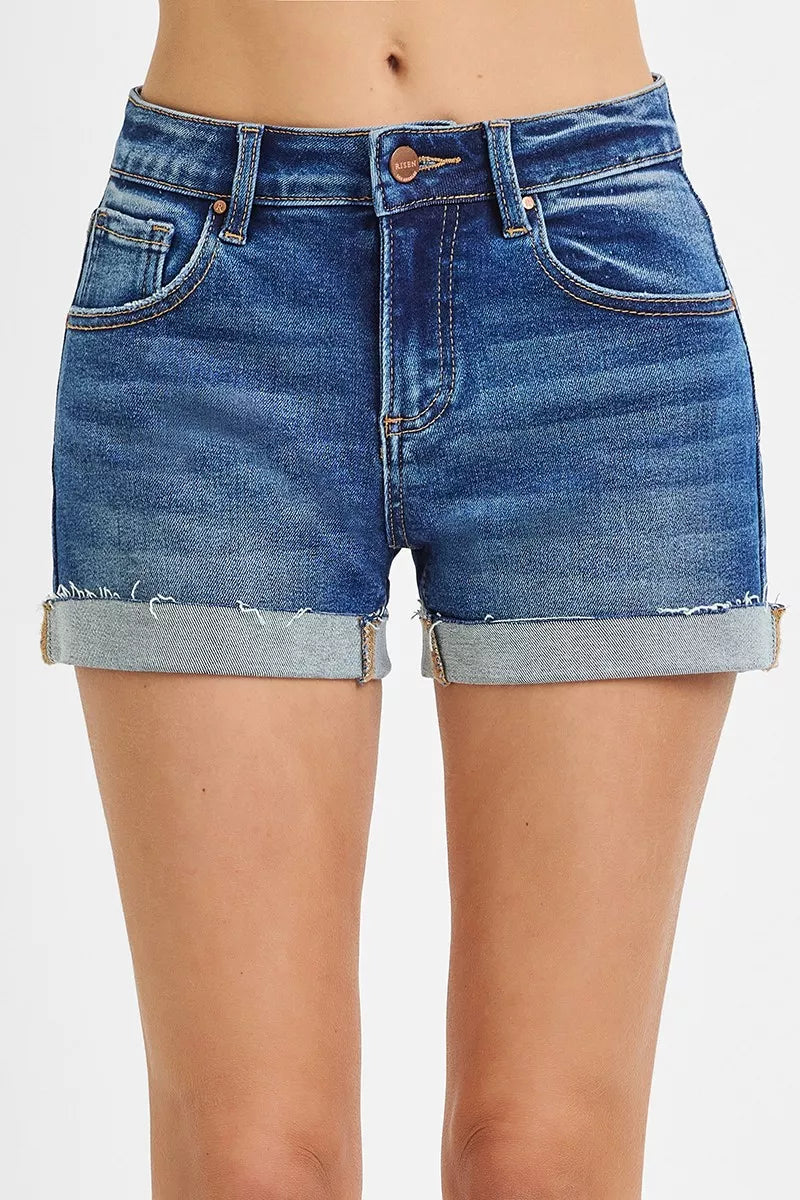 Blue denim shorts on a white background
