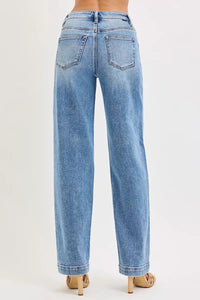 Light blue jeans worn by a person on a white background