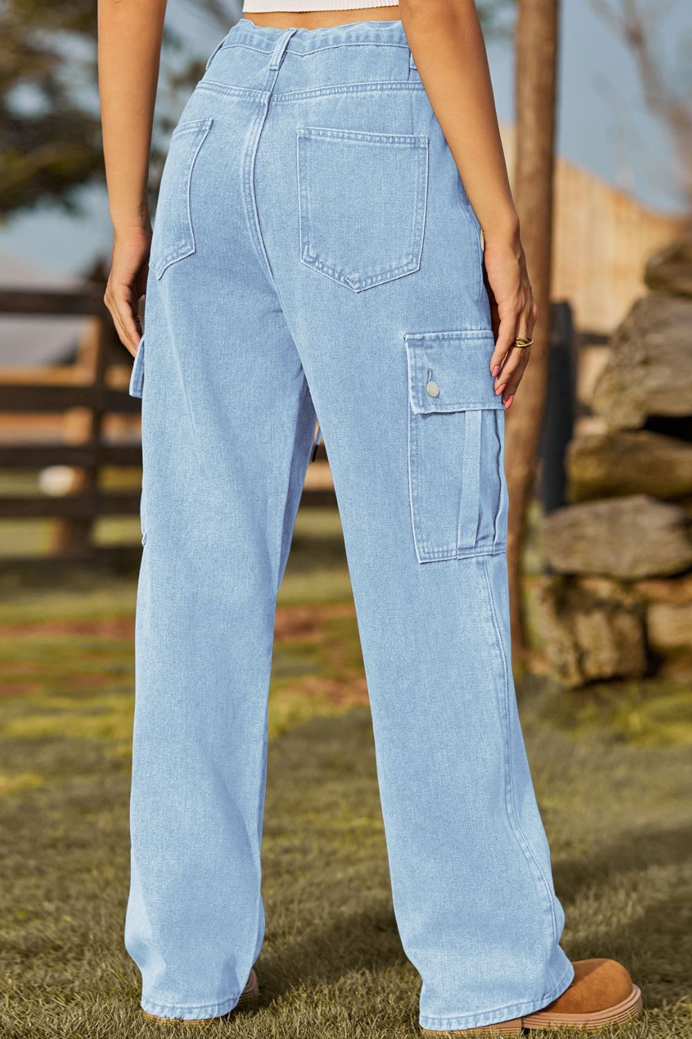 Light blue jeans worn by a person with a blurred natural background