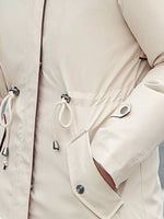 A view of left pocket on Women's Detachable Longline Hooded Parka with Faux Fur Trim and Drawstring Waist