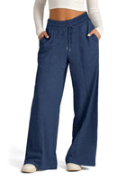 Blue wide-leg pants worn by a person on a white background