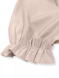 Close-up of a beige skirt with ruffled hem on a white background