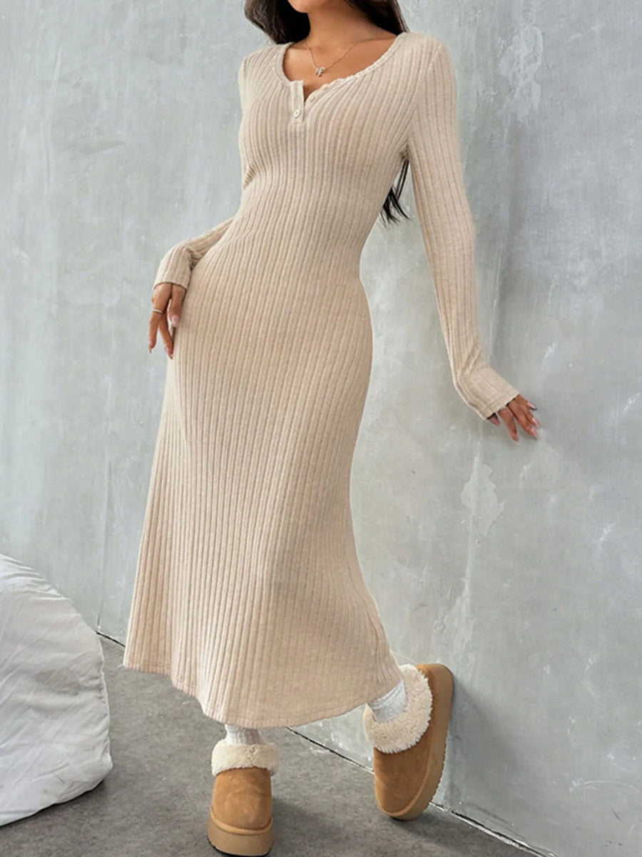 Person wearing a beige ribbed dress with long sleeves against a gray background