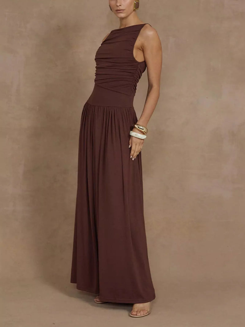 Woman wearing a brown sleeveless dress against a beige background