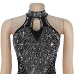 Black halter top with sparkling embellishments on a mannequin against a white background