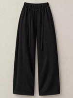 Black wide-leg cropped pants with an elastic drawstring waist, shown flat against a light beige background.