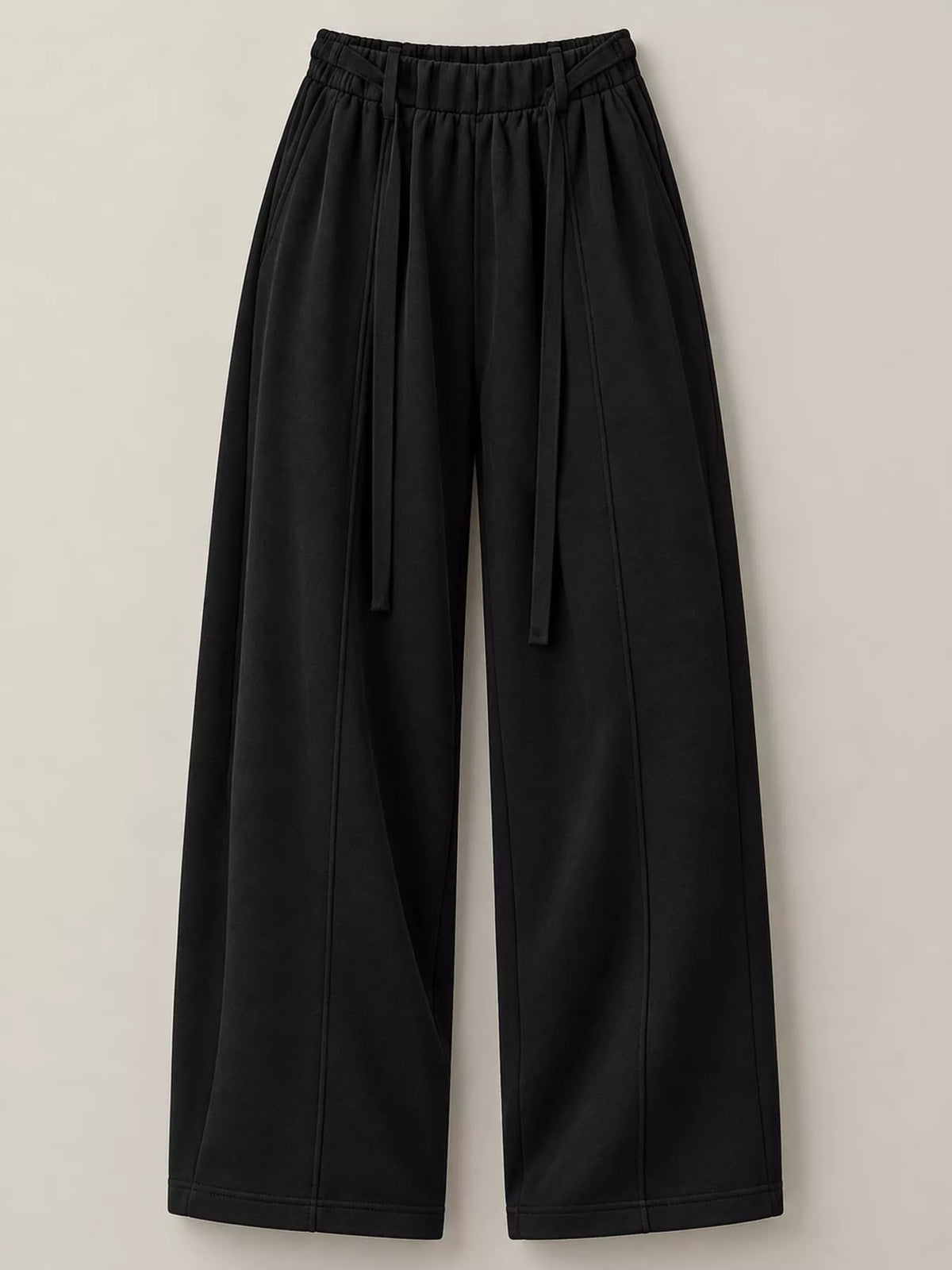 Black wide-leg cropped pants with an elastic drawstring waist, shown flat against a light beige background.