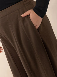 Brown wide-leg pants with a neutral background