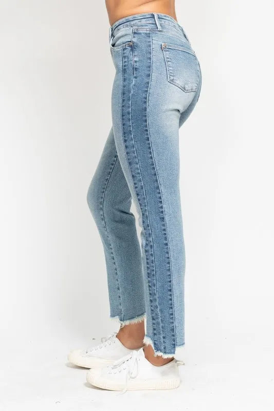 Light blue jeans worn by a person on a white background