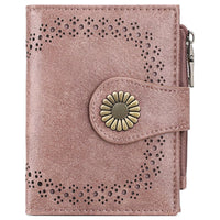 Pink wallet with floral design and button on a white background
