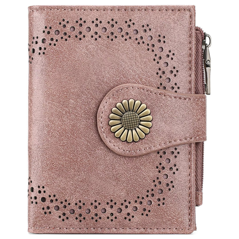 Pink wallet with floral design and button on a white background