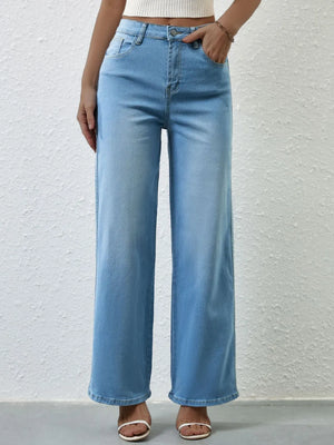 Light blue jeans worn by a person against a plain background