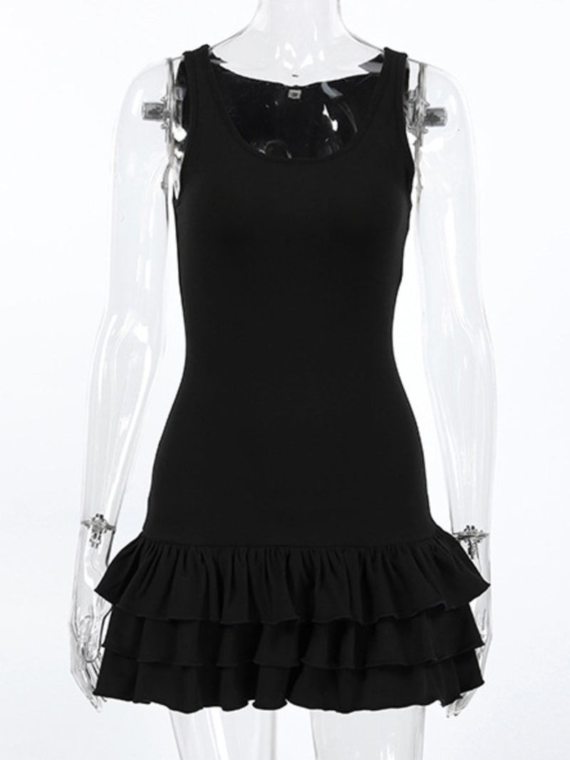 Black dress with ruffled hem on a transparent mannequin against a white background