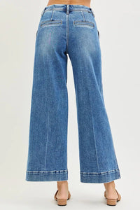 Blue wide-leg jeans on a white background