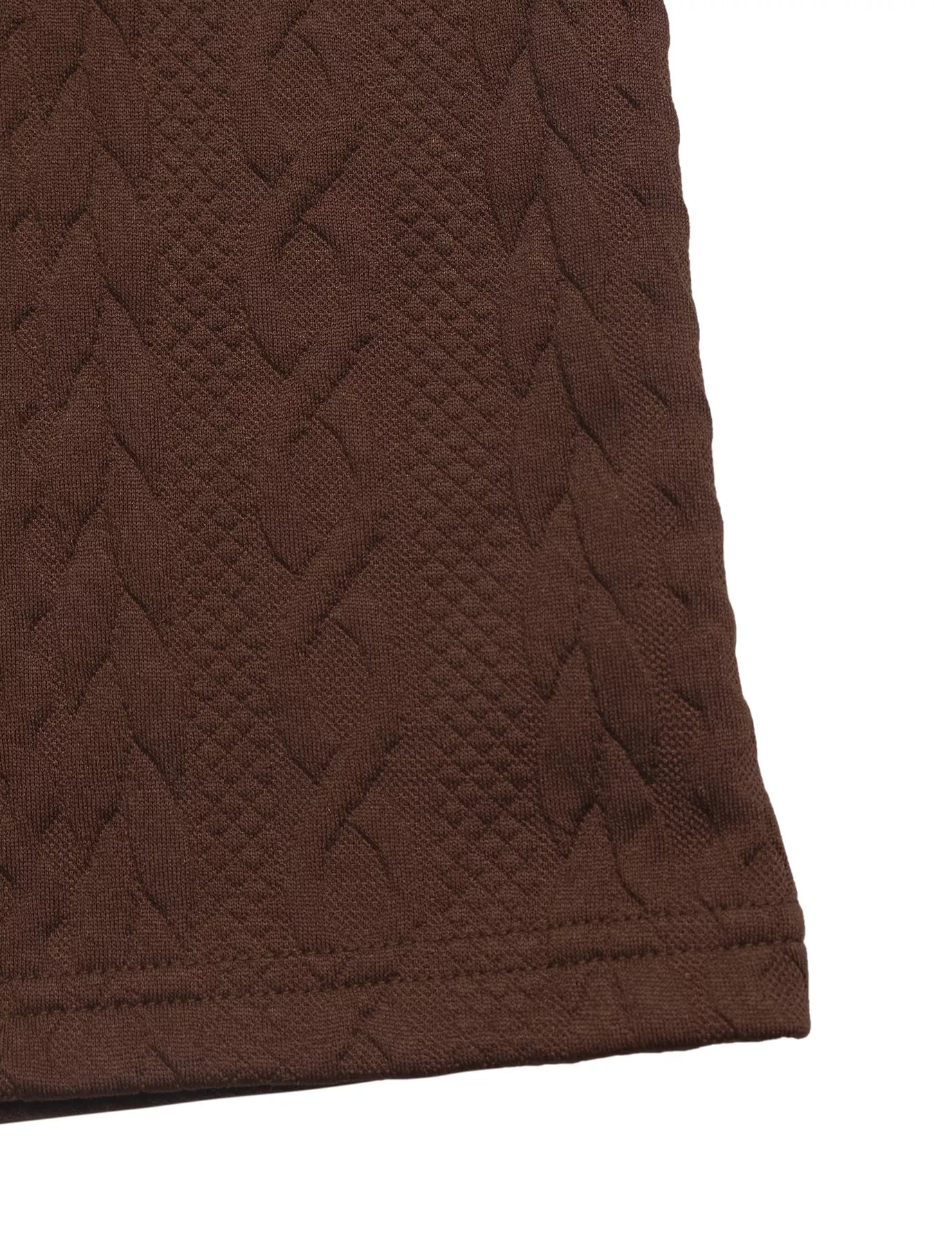 Close-up of brown textured fabric on a white background