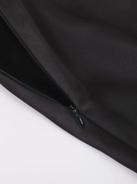 Close-up of a black jacket zipper on a white background