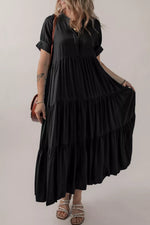 Woman wearing a black dress with a plain background