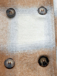 Close-up of a textured fabric surface with buttons