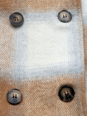 Close-up of a textured fabric surface with buttons