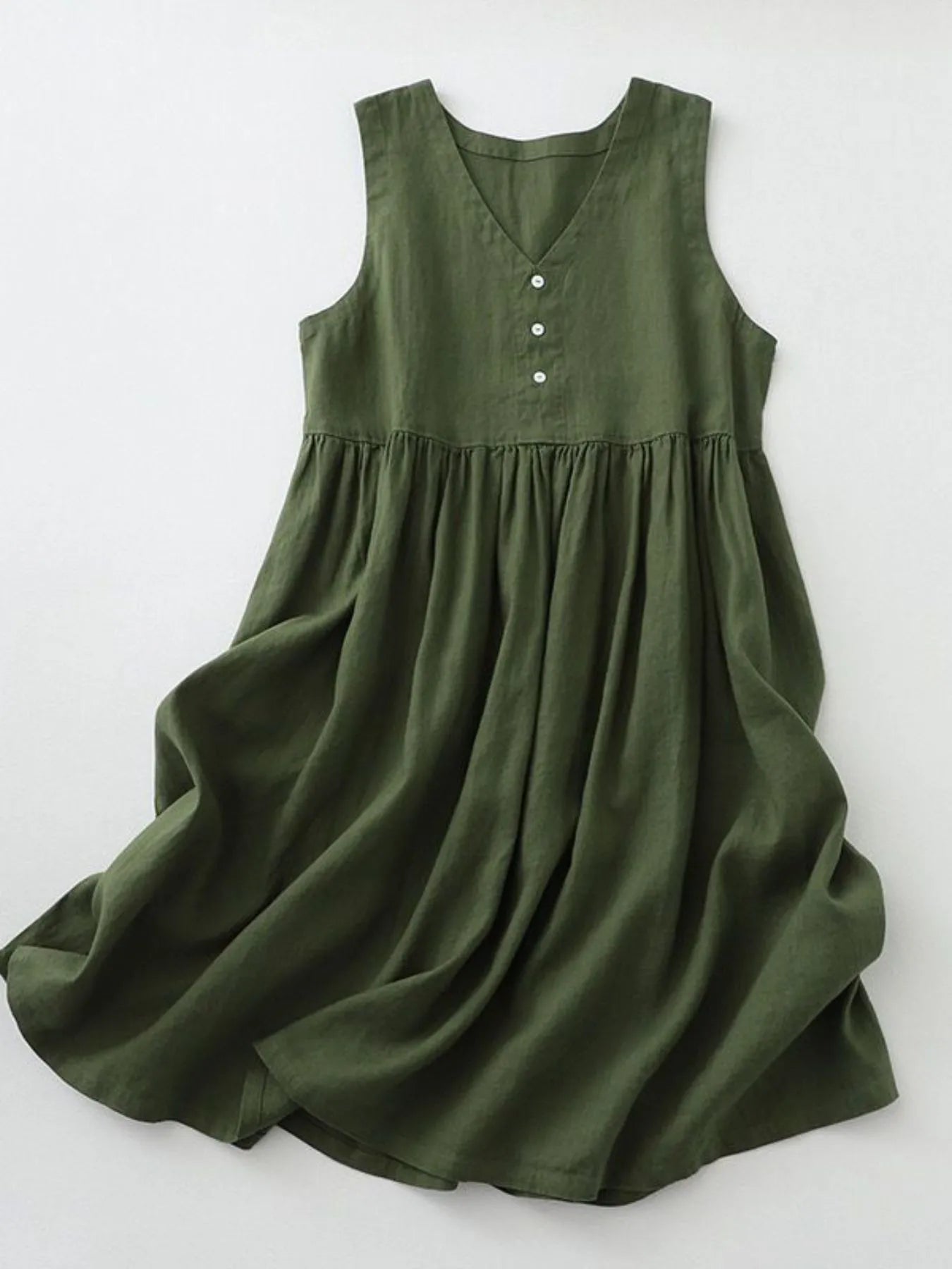 Green dress with buttons on a white background