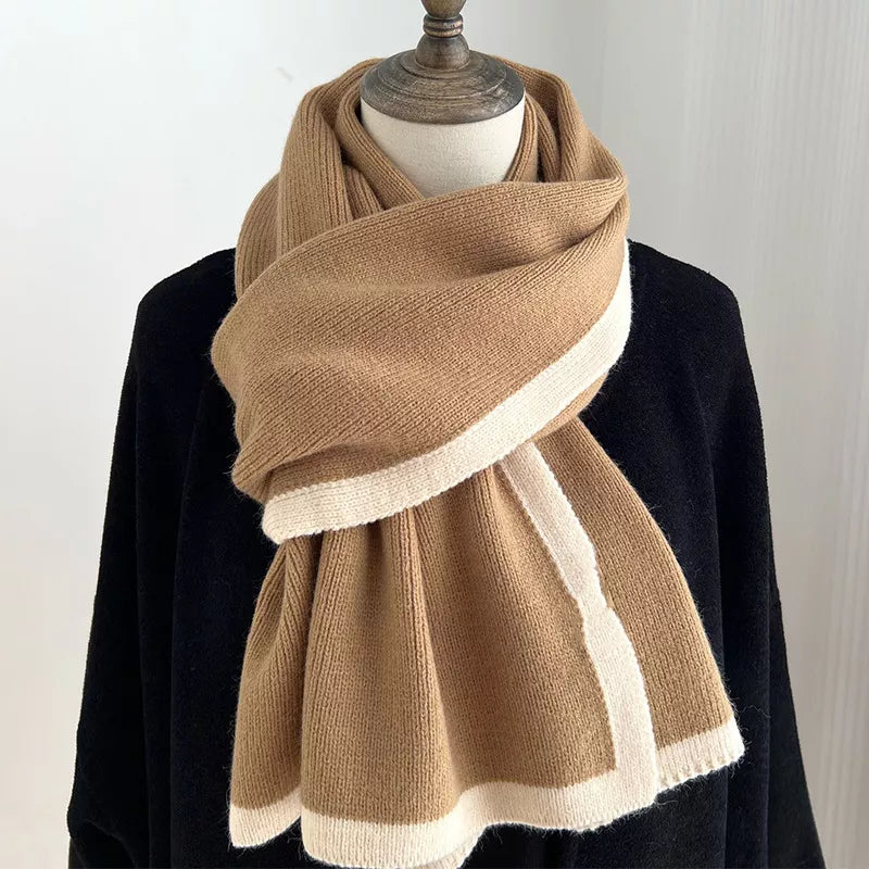 Brown and beige scarf on a mannequin with a plain background