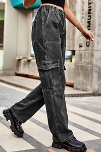 Person wearing black cargo pants walking on a zebra crossing with a blurred background